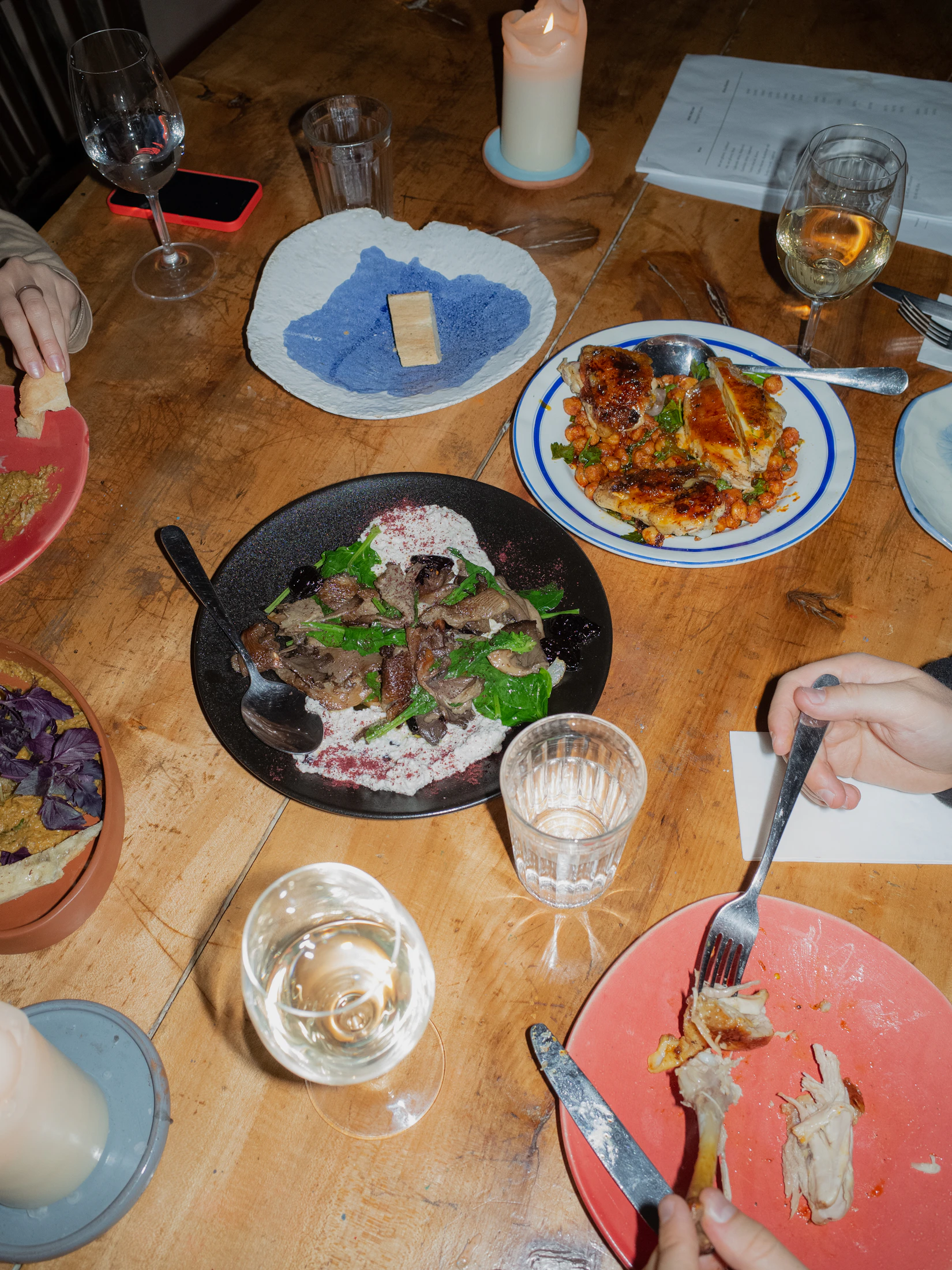A colorful family-style dinner shared around a well-used table